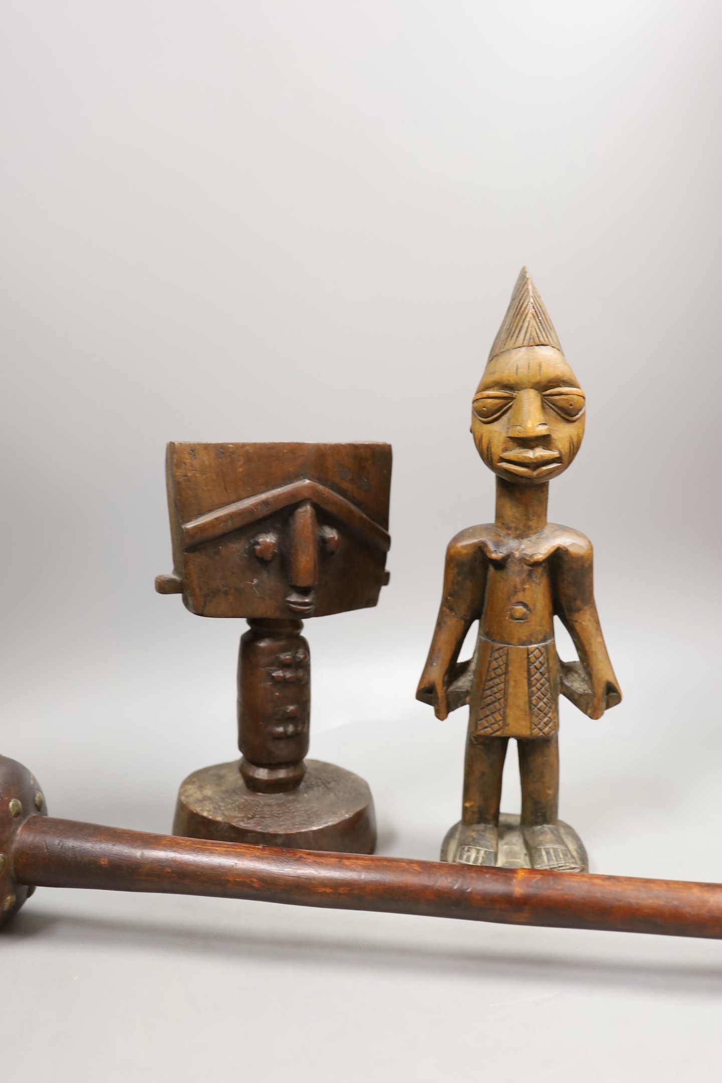 A Zulu knobkerrie, an Ibeji wood figure and a Gabon Fanti fertility figure- Knobkerrie 73 cms long.